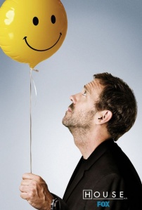 House (Hugh Laurie) stares balefully up at the happy face balloon he hold the string to.