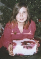 the author as a child with an unopened gift