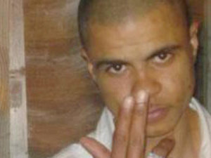 Mark Duggan holding two fingers to his nose, this is currently the most common photo of the slain young man online